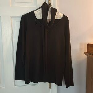 Black sweater with scarf. Decorative collar.